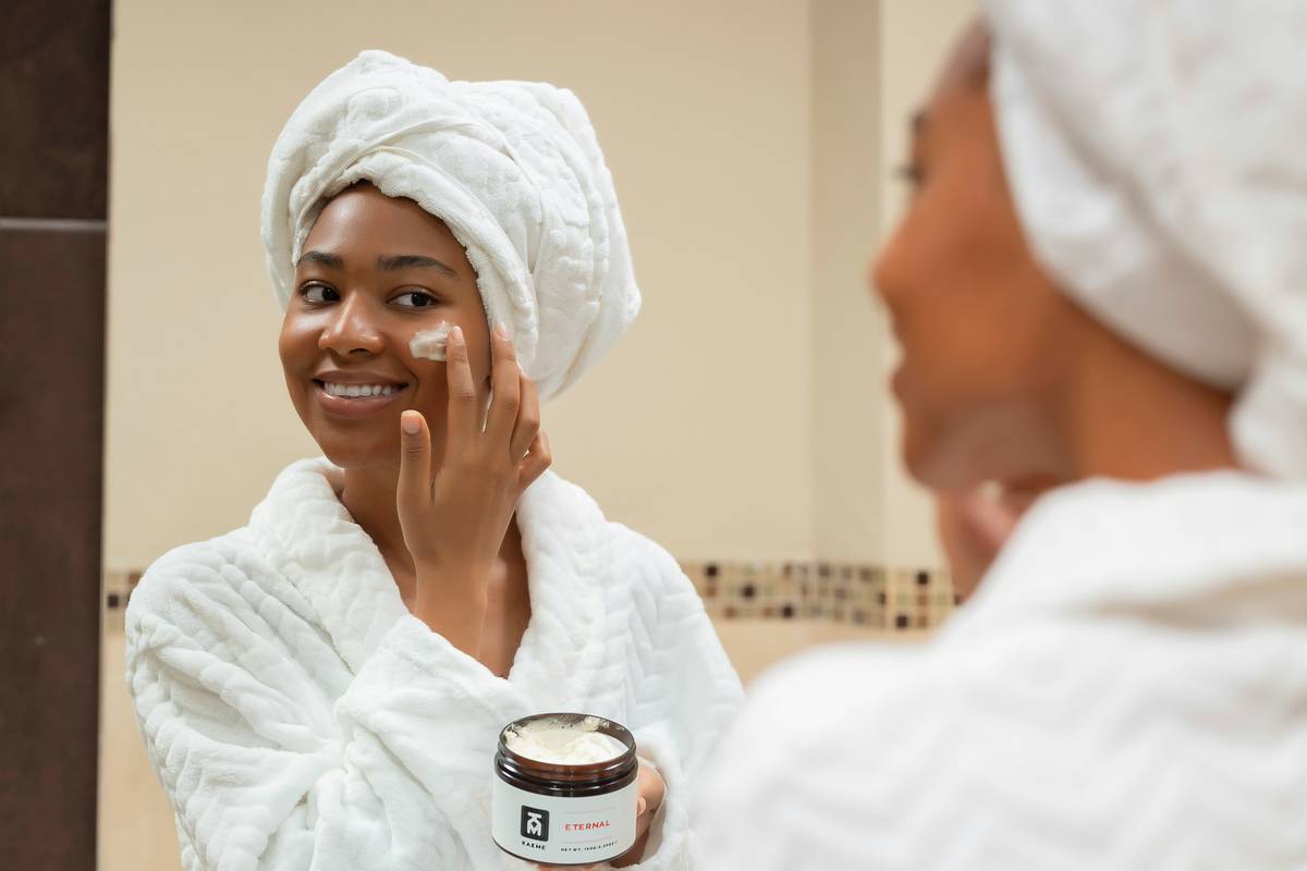 Step-by-step visual guide showing warming body butter in hands, applying to damp arm, and targeting elbows